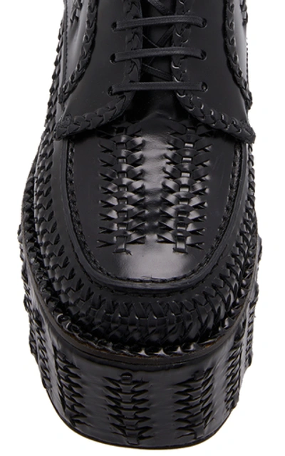 Shop Prada Woven Platform Loafers In Black