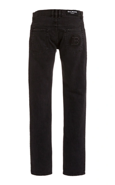 Shop Balmain Six-pocket Monogram Embossed Slim Fit Jeans In Black