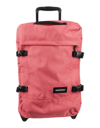 Shop Eastpak Wheeled Luggage In Coral