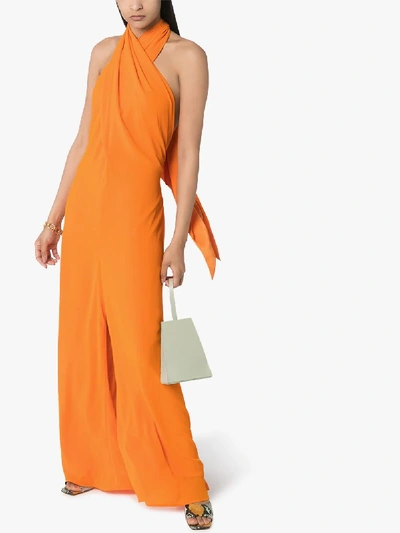 Shop Staud Sycamore Halterneck Jumpsuit In Orange