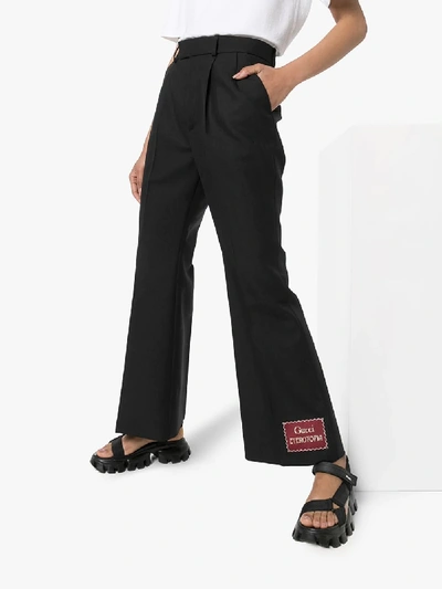 Shop Gucci Flared Wool Trousers In Black