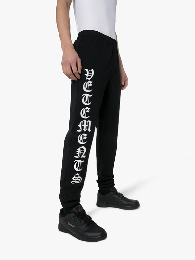Shop Vetements Logo Print Track Pants In Black