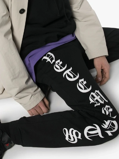 Shop Vetements Logo Print Track Pants In Black