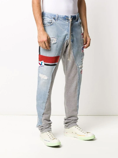 Shop Greg Lauren Contrasting Panel Jogger Jeans In Blue