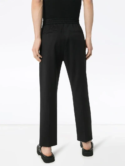 Shop Cmmn Swdn Tapered Drawstring Trousers In Black