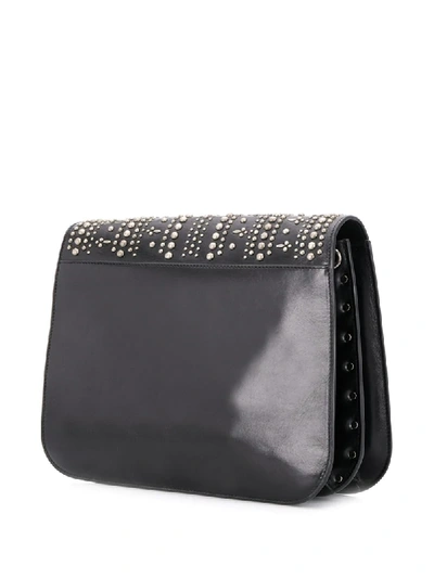 Shop Saint Laurent Studded Saddle Shoulder Bag In Black