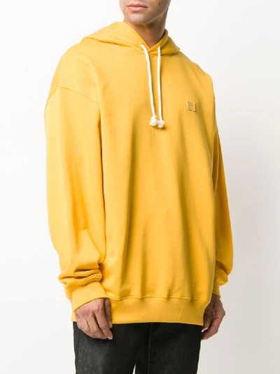 Shop Acne Studios Oversized Cotton Hoodie In Yellow