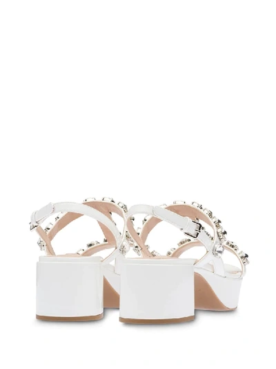 Shop Miu Miu 50mm Crystal-embellished Sandals In White