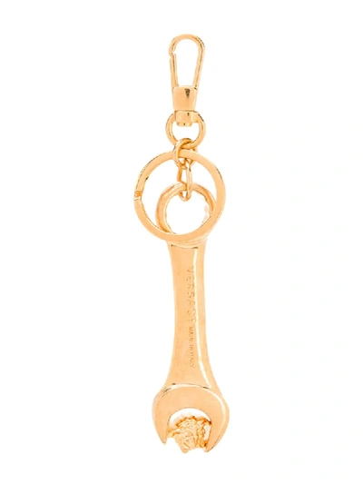 Shop Versace Wrench Keyring In Gold