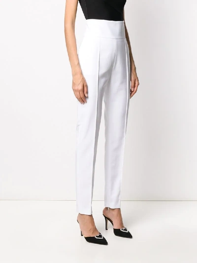 Shop Alexandre Vauthier High-waisted Slim-fit Trousers In White