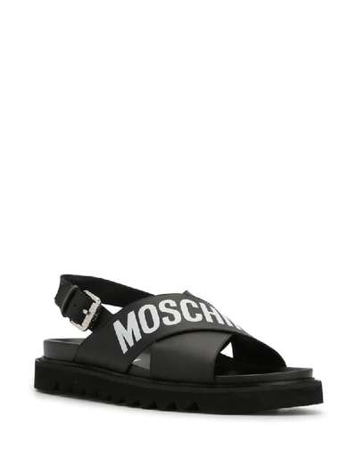 Shop Moschino Logo Print Sandals In Black
