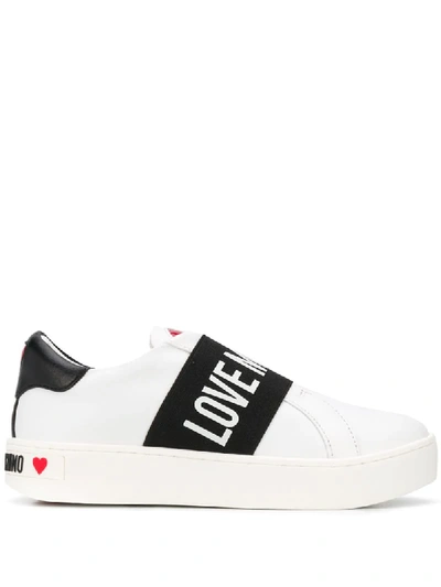 Shop Love Moschino Flat Low Top Sneakers In White
