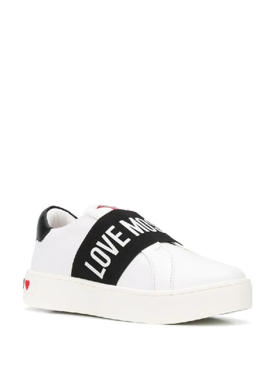 Shop Love Moschino Flat Low Top Sneakers In White