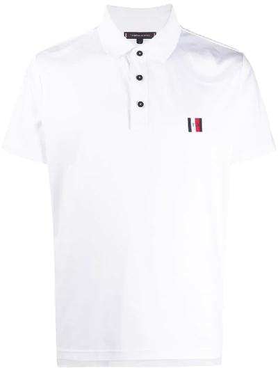 Shop Tommy Hilfiger Logo Embroidered Polo Shirt In White