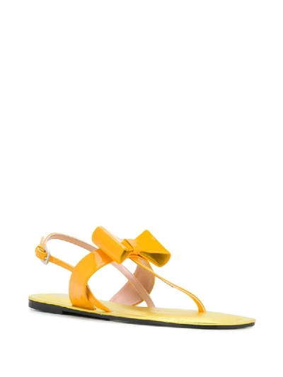 Shop Pollini Bow Detail Flat Sandals In Yellow