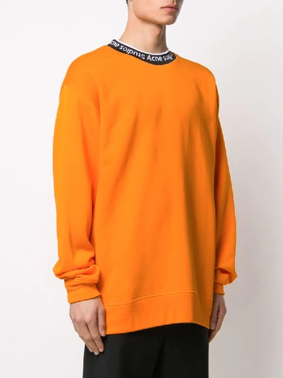 Shop Acne Studios Neck Logo Oversized Sweatshirt In Orange