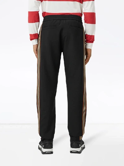 Shop Burberry Icon Stripe Track Pants In Black