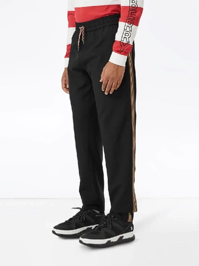 Shop Burberry Icon Stripe Track Pants In Black