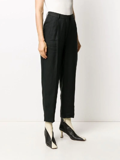 Shop Remain High-rise Pleated Trousers In Black