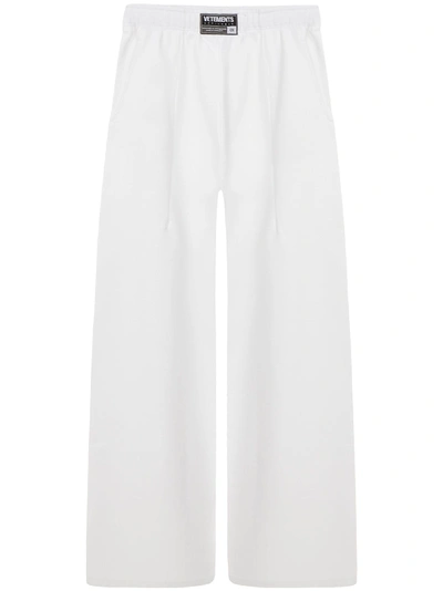 Shop Vetements Trousers In White