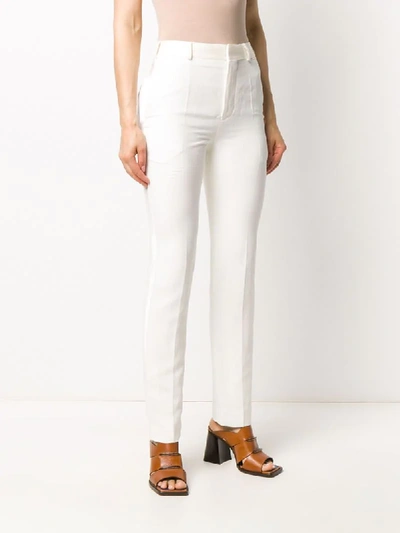 Shop Haider Ackermann High-waisted Tapered Trousers In White