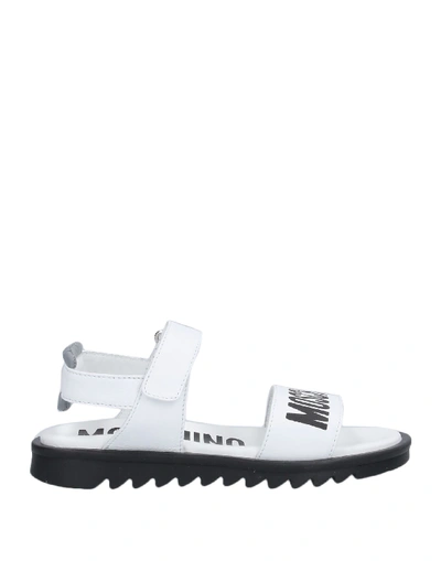 Shop Moschino Sandals In White