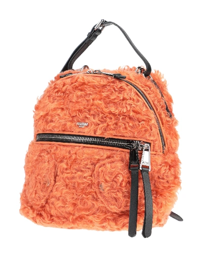 Shop Moschino Backpacks & Fanny Packs In Orange