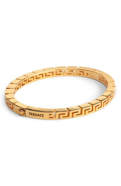Shop Versace Greek Key Bracelet In Warm Gold