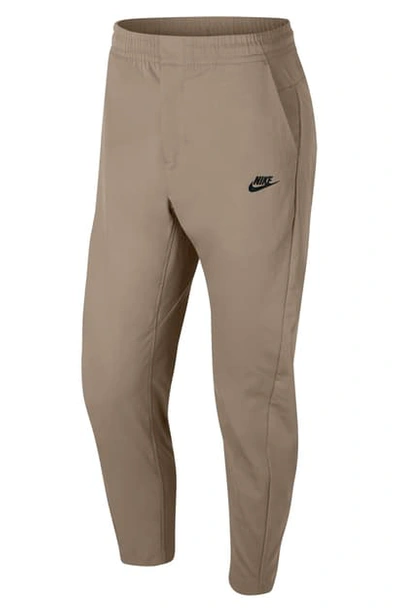 Shop Nike Sportswear Woven Pants In Khaki/ Black
