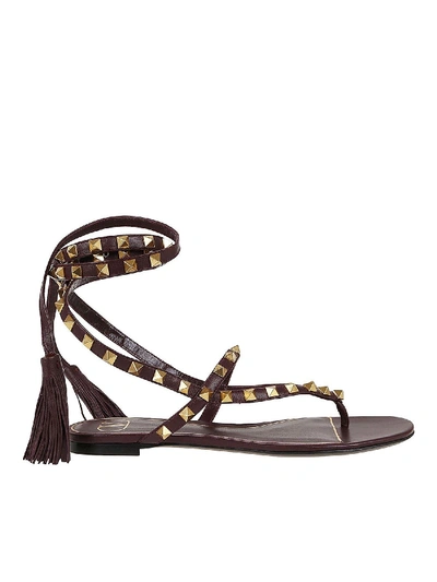 Shop Valentino Rockstud Thong Sandals With Tassels In Black
