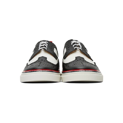 Shop Thom Browne Black And White Longwing Brogue Sneakers In 980 Blkwht