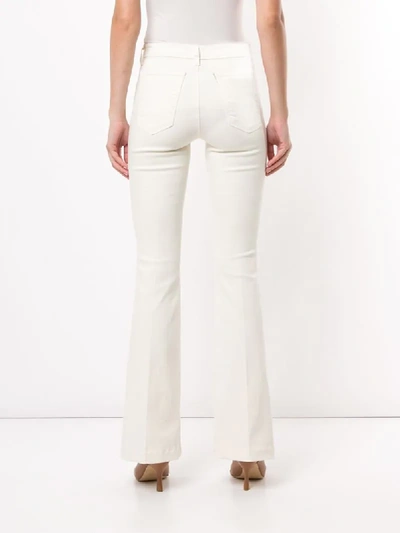 Shop L Agence Joplin Flared Jeans In White