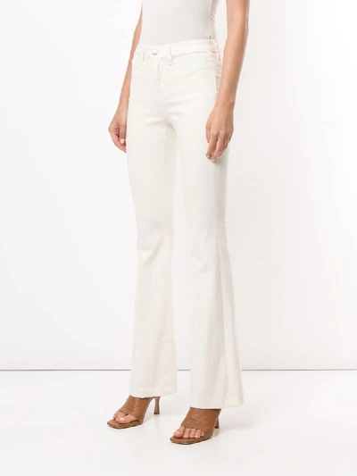 Shop L Agence Joplin Flared Jeans In White