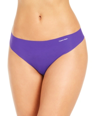 Shop Calvin Klein Women's Invisibles Thong Underwear D3428 In Rich Violet
