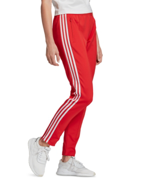 white adidas track pants with red stripes