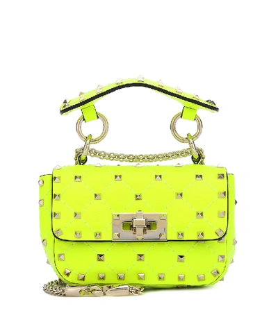 Shop Valentino Rockstud Spike Mini Crossbody Bag In Yellow