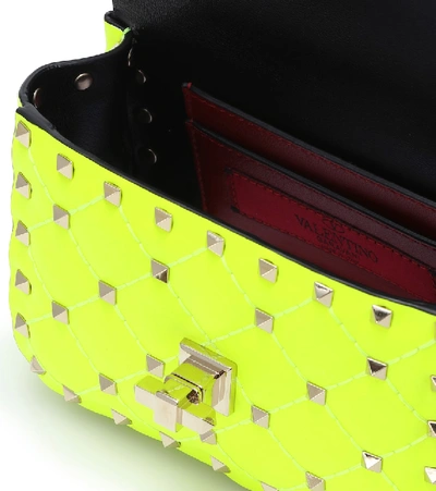 Shop Valentino Rockstud Spike Mini Crossbody Bag In Yellow