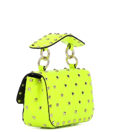 Shop Valentino Rockstud Spike Mini Crossbody Bag In Yellow