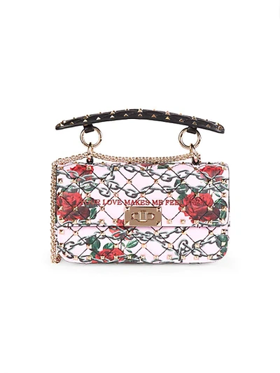 Shop Valentino Rockstud Print Leather Top Handle Bag In Red