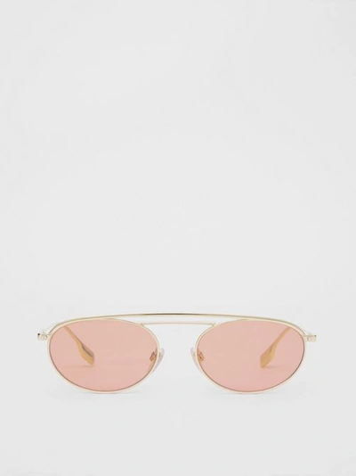 Shop Burberry Oval Frame Sunglasses In Light Pink