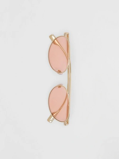 Shop Burberry Oval Frame Sunglasses In Light Pink