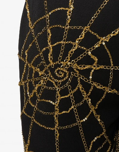 Shop Moschino Spider Webs Grain De Poudre Trousers In Black