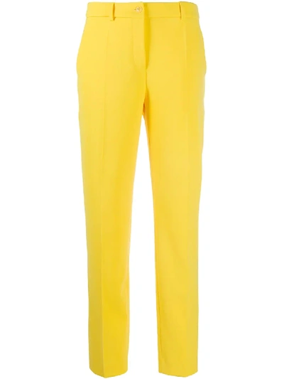 Shop Boutique Moschino Mid-rise Slim-fit Trousers In Yellow