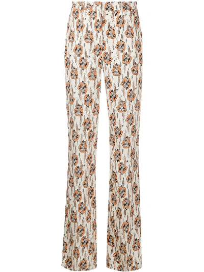 Shop Prada Printed Flared Trousers In Weiss