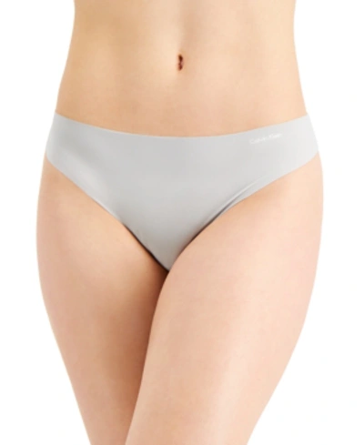 Shop Calvin Klein Women's Invisibles Thong Underwear D3428 In Jet Grey