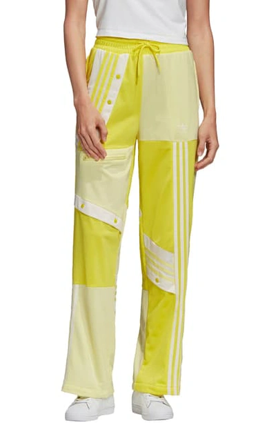 Shop Adidas Originals D. Cathari Track Pants In Shock Yellow/ Yellow Tint