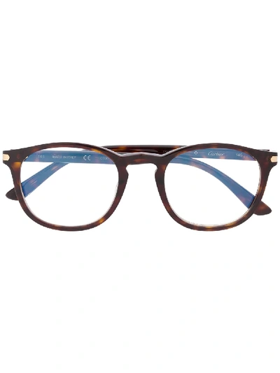 Shop Cartier Round Frame Glasses In Brown