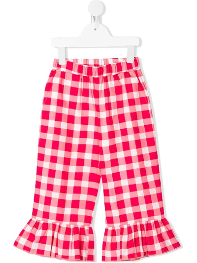 Shop Touriste Check Print Trousers In Pink