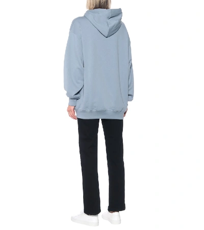 Shop Acne Studios Face Oversized Cotton Hoodie In Blue
