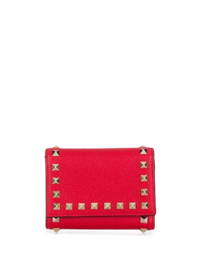 Shop Valentino Rockstud Tri-fold Wallet In Red